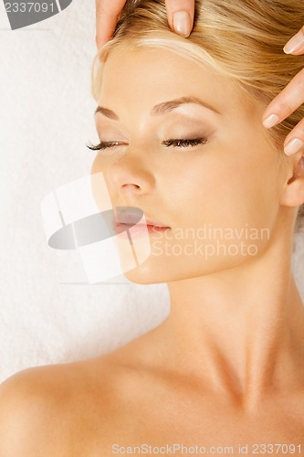 Image of beautiful woman in massage salon