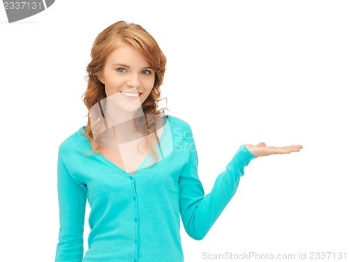 Image of girl showing something on the palm of her hand