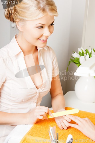 Image of woman having a manicure at the salon