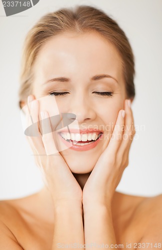 Image of face and hands of beautiful woman
