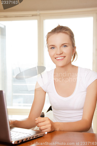 Image of happy teenage girl with laptop computer