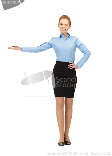 Image of smiling stewardess showing direction