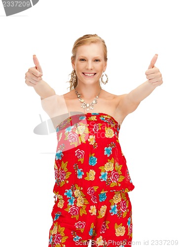 Image of beautiful teenage girl with thumbs up