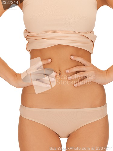 Image of woman body in beige cotton undrewear