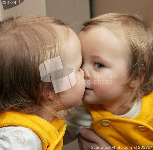 Image of child behind mirror