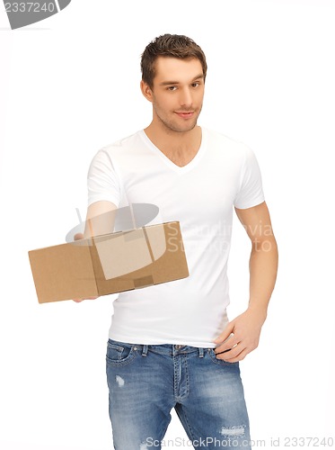 Image of handsome man with box