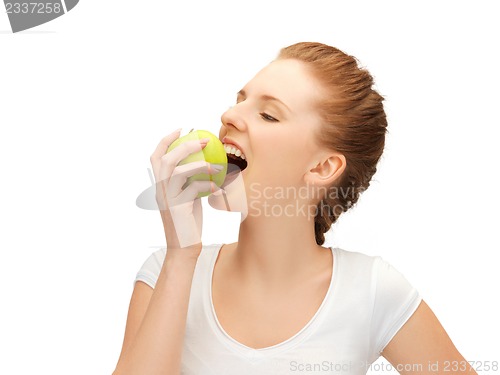 Image of teenage girl biting a green apple