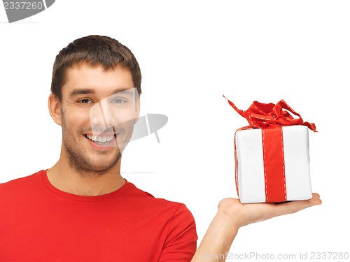 Image of handsome man with a gift