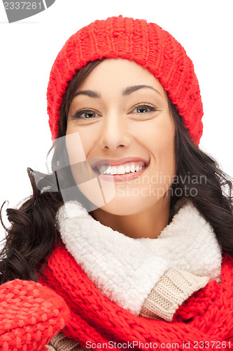 Image of beautiful woman in hat, muffler and mittens