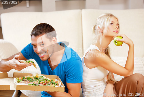 Image of couple eating different food