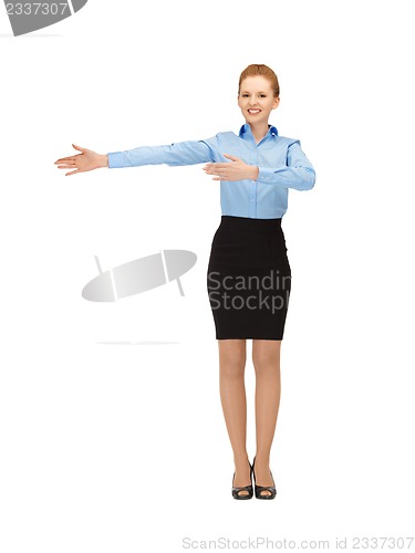 Image of smiling stewardess showing direction