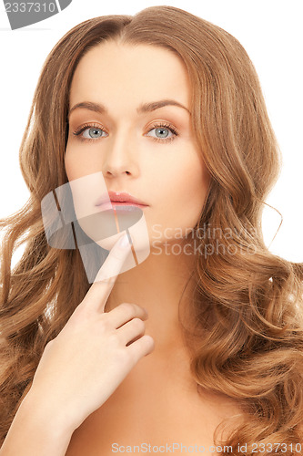 Image of woman pointing to chin