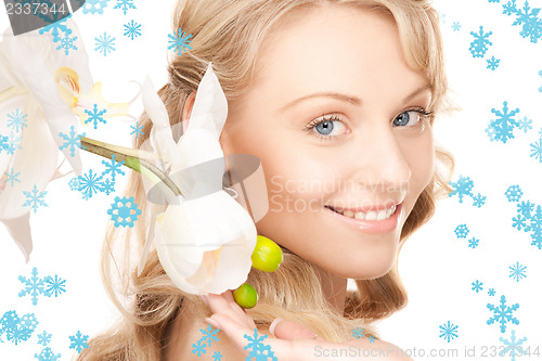 Image of beautiful woman with white flower