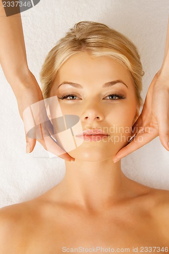 Image of beautiful woman in massage salon