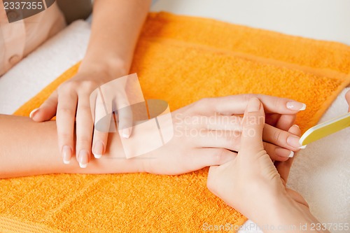 Image of manicure process on female hands