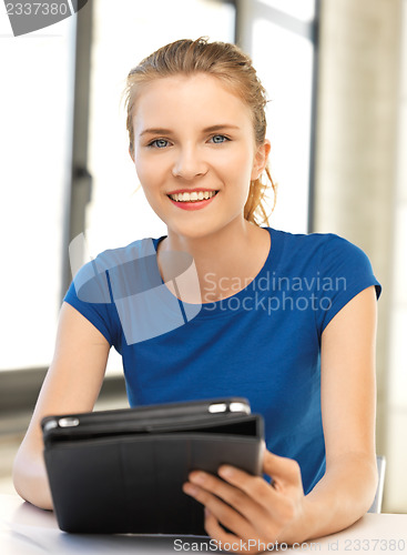 Image of happy teenage girl with tablet pc computer
