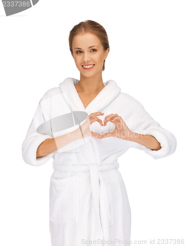 Image of beatiful woman with heart shaped hands