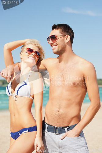 Image of couple walking on the beach