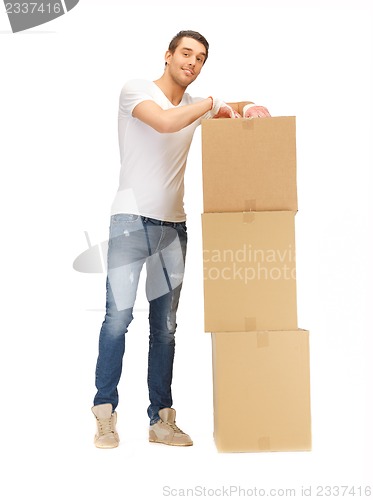 Image of handsome man with big boxes