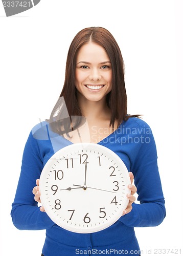 Image of woman holding big clock