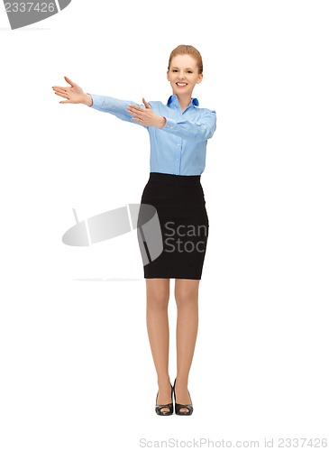 Image of smiling stewardess showing direction