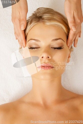 Image of beautiful woman in massage salon