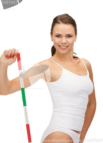 Image of young beautiful woman with measure tape