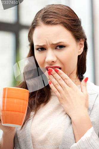 Image of lovely businesswoman with mug