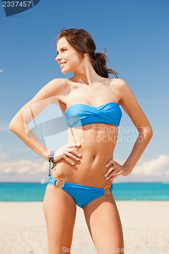 Image of happy smiling woman on the beach