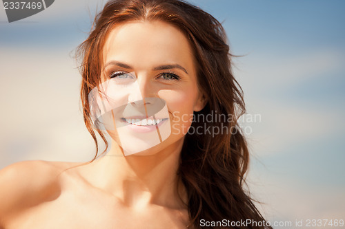 Image of beautiful woman on a beach