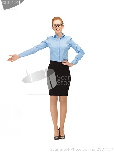 Image of attractive businesswoman pointing her hand
