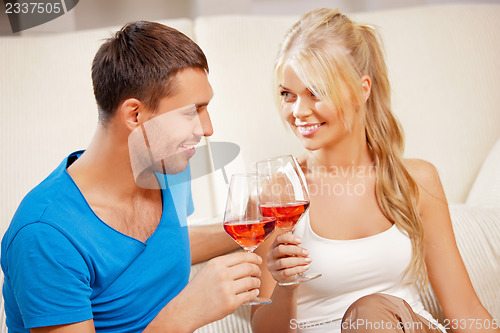 Image of romantic couple drinking wine