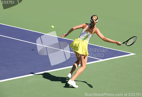 Image of Woman playing tennis