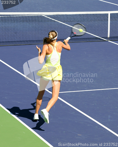 Image of Woman playing tennis