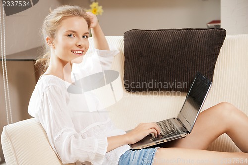 Image of happy teenage girl with laptop computer