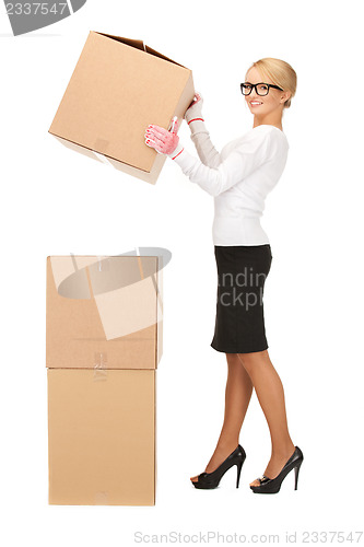 Image of businesswoman with big boxes