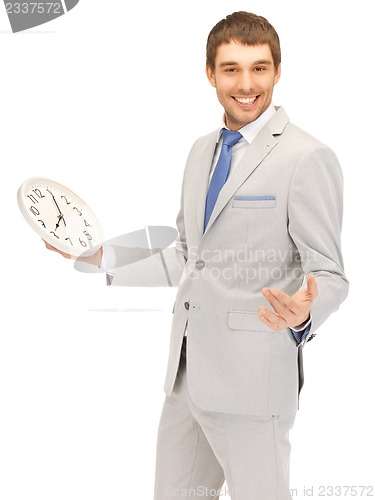 Image of handsome man with clock