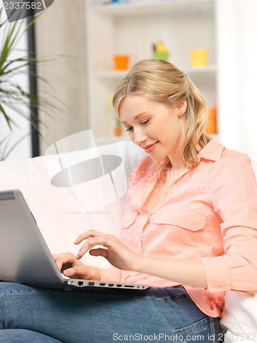 Image of happy woman with laptop computer