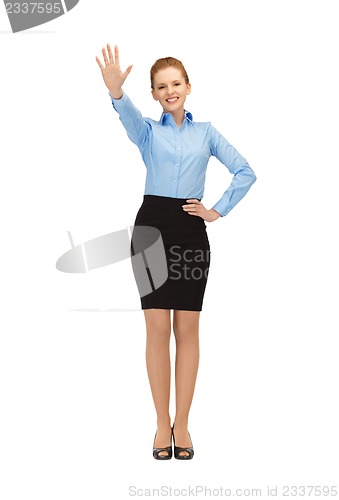 Image of stewardess making greeting gesture