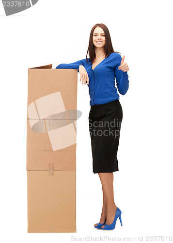 Image of businesswoman with big boxes