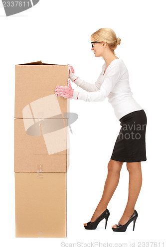 Image of businesswoman with big boxes