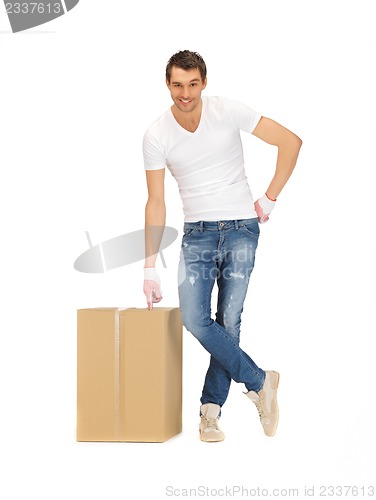Image of handsome man with big box