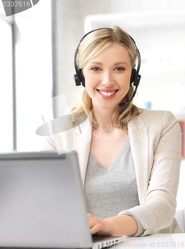 Image of helpline operator with laptop computer