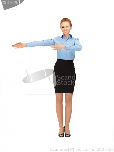 Image of smiling stewardess showing direction