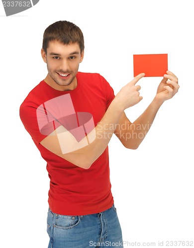 Image of handsome man with note card