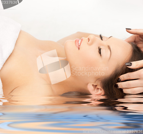 Image of beautiful woman in massage salon