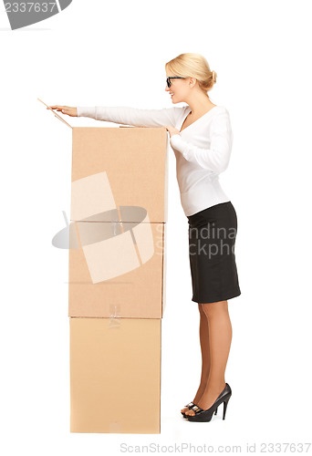 Image of businesswoman with big boxes