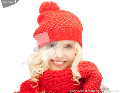 Image of beautiful woman in hat, muffler and mittens