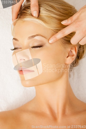 Image of beautiful woman in massage salon