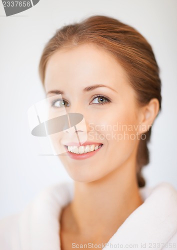Image of beautiful woman in bathrobe